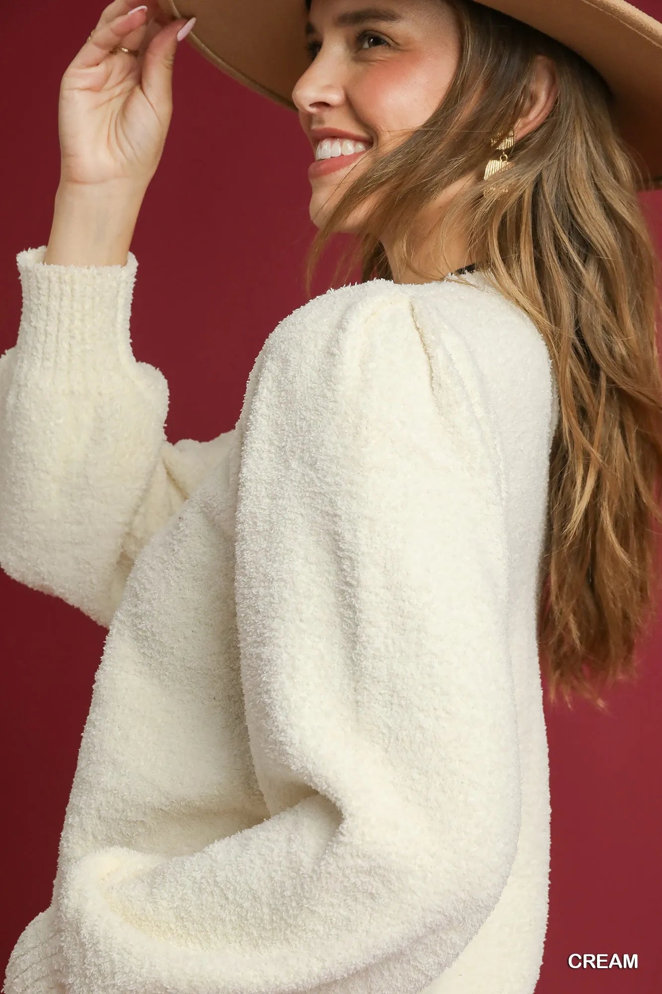 Umgee textured sweater in cream featuring puff sleeves and a cozy design for stylish layering