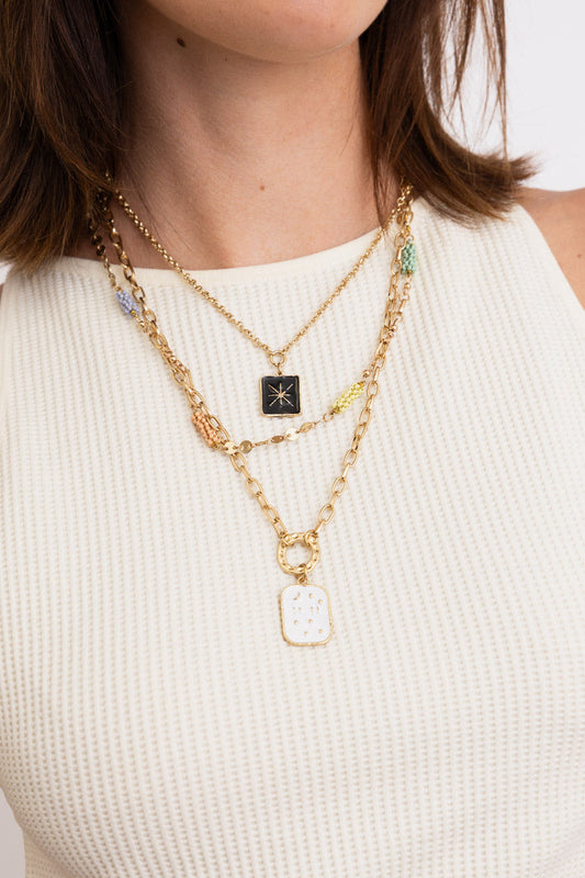 Leto Collection layered gold pendant necklaces on model wearing white ribbed top Boho Necklace, Boho Chic Jewelry, Spiritual