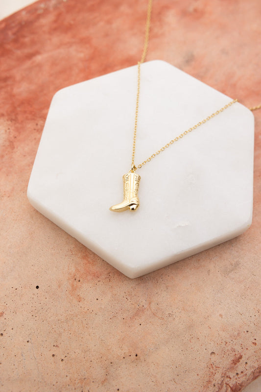 Leto Collection gold cowboy boot pendant necklace on chain on marble slab Boho Necklace, Boho Chic Jewelry, Spiritual