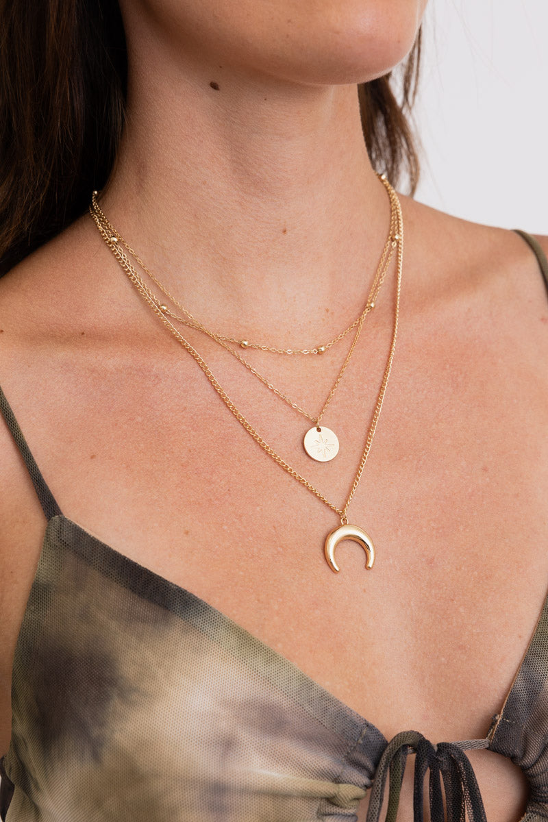 Leto Collection layered gold necklaces with disc and crescent pendant on model chest Boho Necklace, Boho Chic Jewelry, Spiritual
