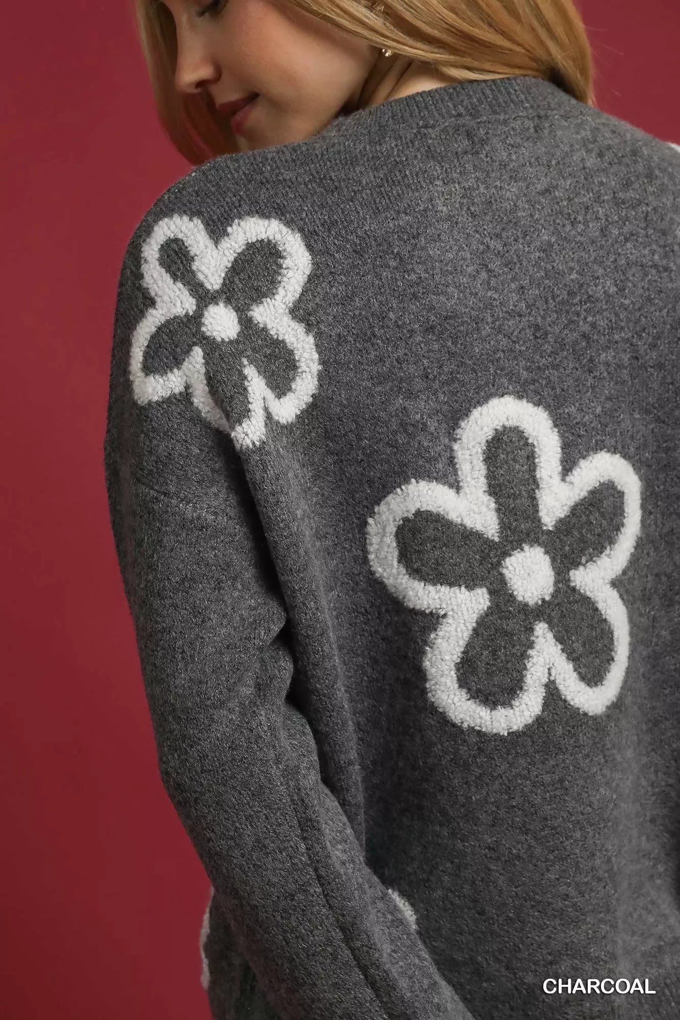 Boho floral sweater for women in charcoal with soft white flower designs on the back