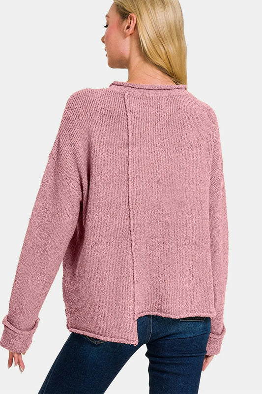 Trendsi Asymmetric hem boho sweater in soft pink with a relaxed fit and back seam detail