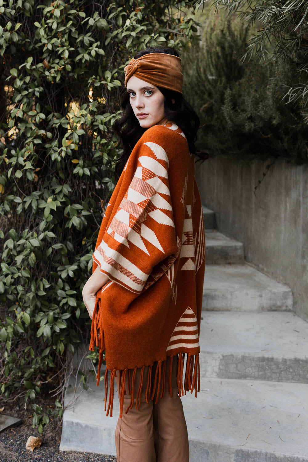 Leto Collection Aztec print fringed ruana in rust color for stylish layering and warmth
