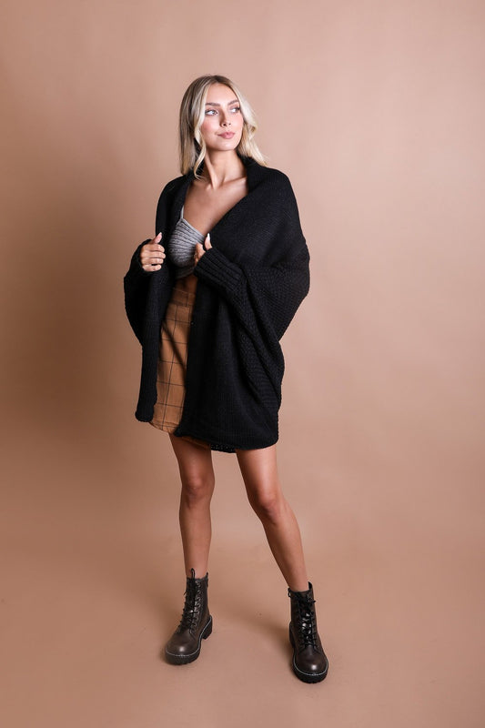 Leto Collection boho bat sleeve knit cardigan in black, styled with boots for a chic look
