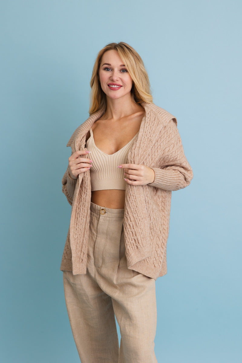 Leto Collection chunky cable knit poncho cardigan in beige, styled with a matching outfit for a cozy look