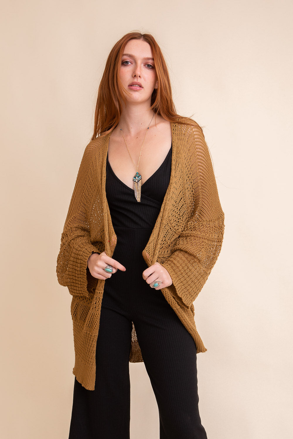 Leto Collection boho knit cardigan in camel color, styled over a black outfit for a chic look