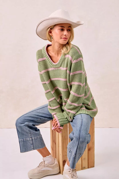 Trendsi boho striped long sleeve sweater in green and pink, styled with denim and a wide-brim hat