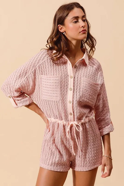 Pink textured knit romper for women with button-up front and drawstring waist for a relaxed fit