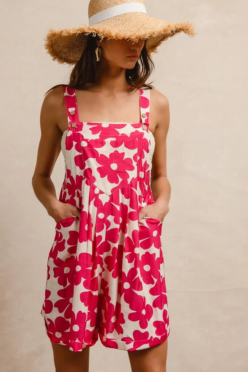 Floral print short overalls for women in pink and white with pockets and adjustable straps