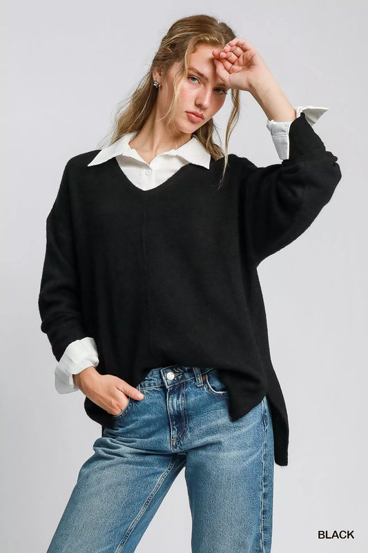 Umgee wool blend pullover sweater in black worn over a white shirt with casual denim jeans