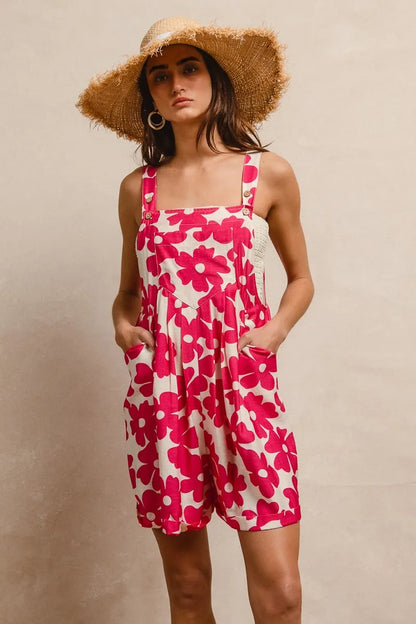 Trendy floral print short overalls for women in pink and white with pockets and adjustable straps