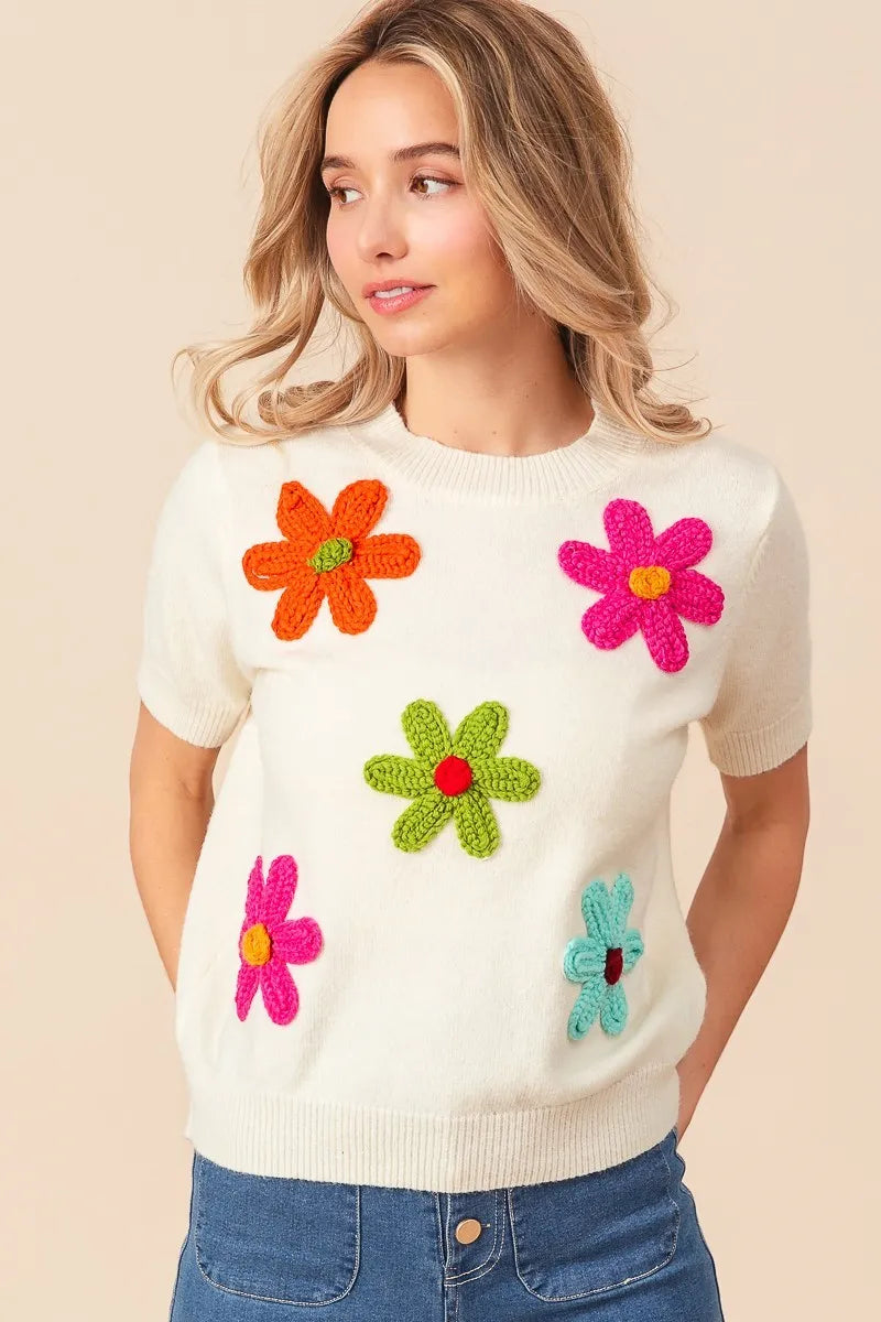 Trendsi crochet flower sweater top with colorful flower appliques on a cream background