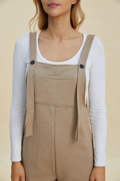 Trendsi boho sleeveless romper in beige with stylish suspenders and textured design