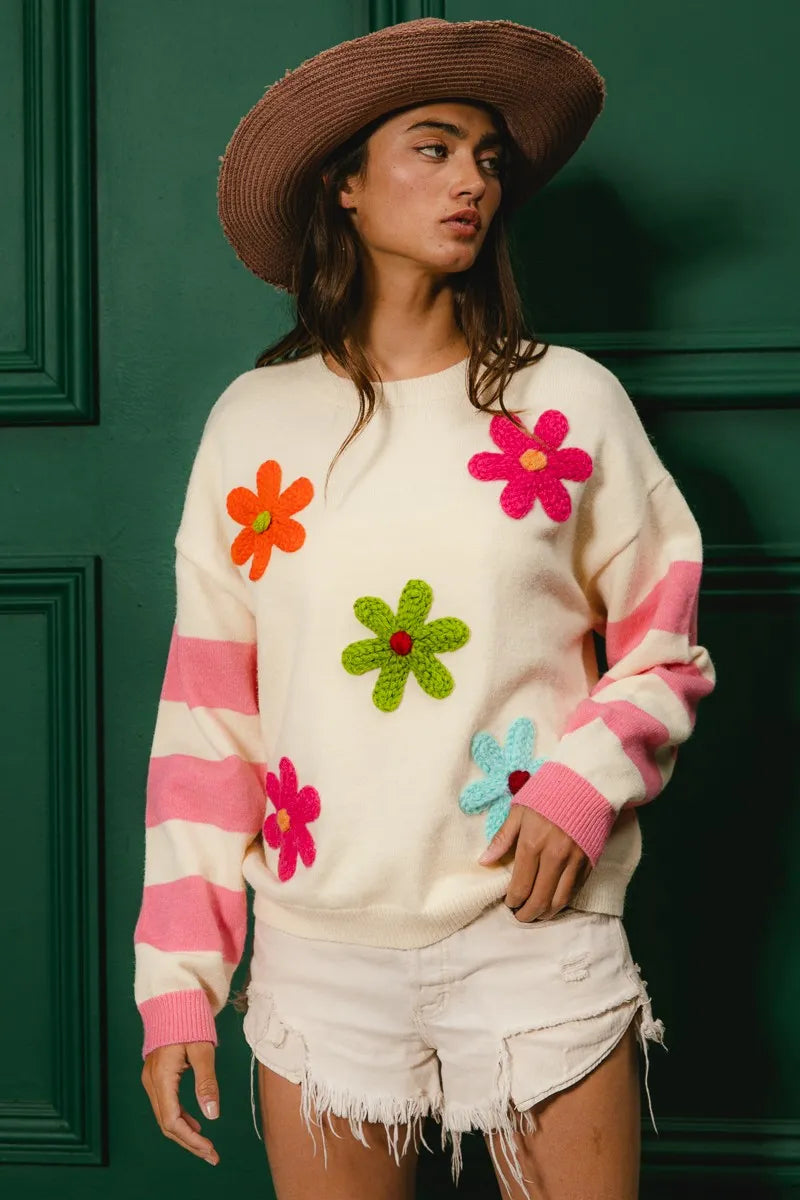 Trendy colorful floral sweater for women with vibrant flower appliques and pink stripes