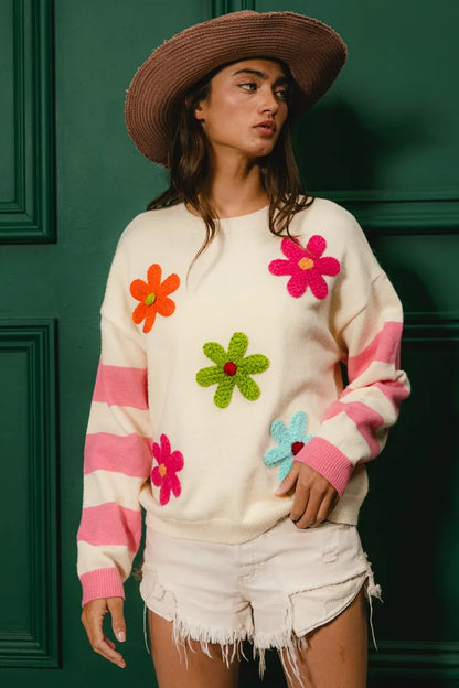 Trendy colorful floral sweater for women with vibrant flower appliques and pink stripes