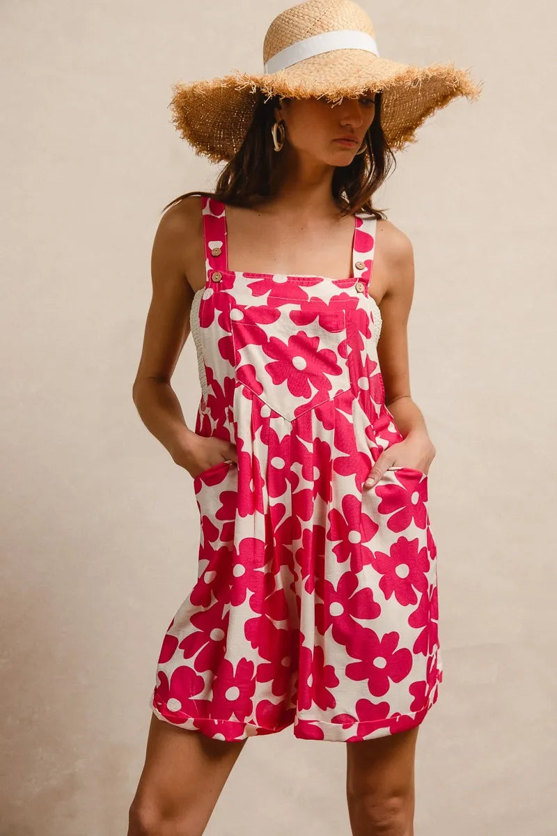 Trendy floral print short overalls for women in vibrant pink and white with pockets