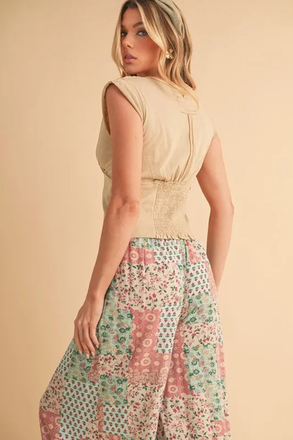 Trendy boho wide leg pants featuring a colorful floral patchwork design for a stylish summer look