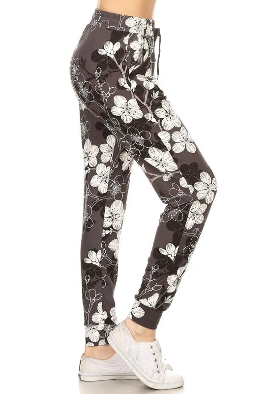 Buttery soft floral joggers in gray with white floral designs, perfect for casual wear and comfort