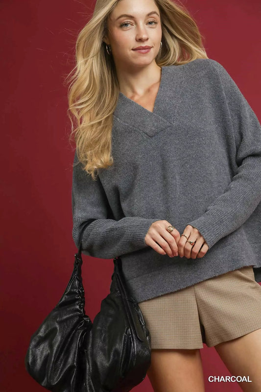Umgee V-neck sweater for women in charcoal, styled with shorts and a handbag for a chic look