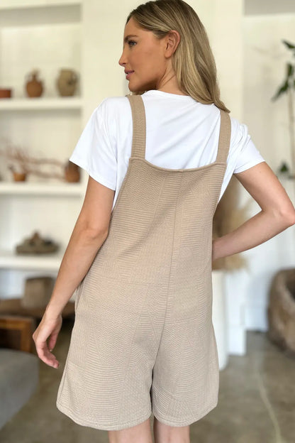 Stylish boho sleeveless romper in beige with a relaxed fit, perfect for casual summer outings