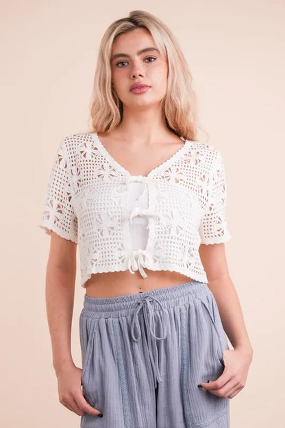 Trendsi Crochet Front Tie Crop Top in White, featuring short sleeves and a stylish design