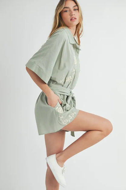 Trendsi embroidered button down romper in light green with pockets and a tied waist for a stylish look