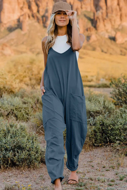 Trendsi boho v-neck sleeveless jumpsuit in blue with relaxed fit and front pockets
