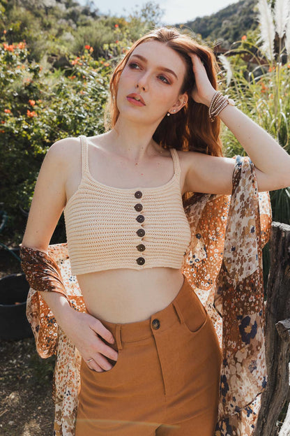 Leto Collection boho button down knit brami top in cream worn with high-waisted brown pants and a floral scarf