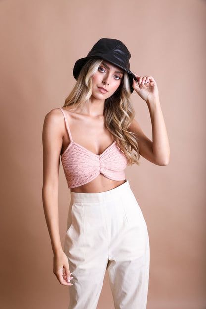 Leto Collection cozy knit brami top in soft pink, styled with high-waisted pants and a black hat