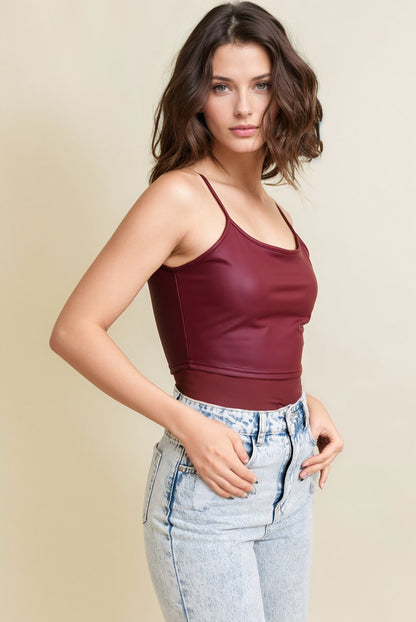 Leto Collection leatherette crop cami top in burgundy paired with high-waisted jeans