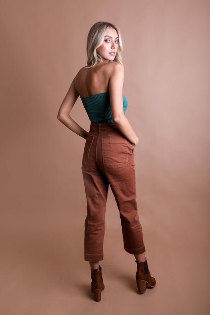 Model wearing a Leto Collection boho bandeau top with high-waisted pants for a stylish look