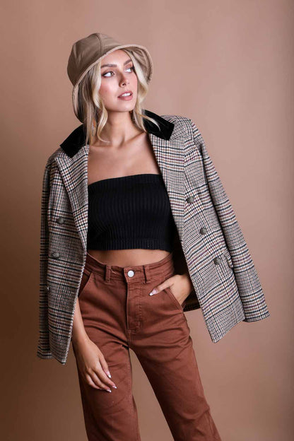Model wearing a stylish boho bandeau top with a plaid blazer and brown pants for a chic look