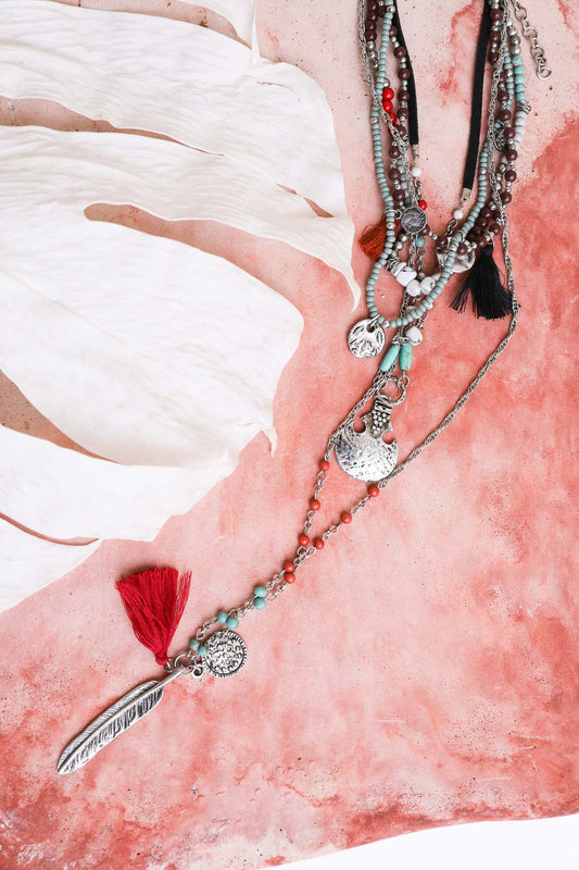 Leto Collection layered Boho Necklace, Boho Chic Jewelry, Spiritual beaded silver pendants turquoise beads and red tassel