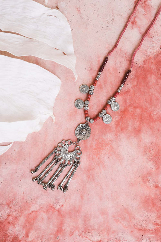 Leto Collection silver coin Boho Necklace, Boho Chic Jewelry, Spiritual beaded tassel pendant on pink backdrop