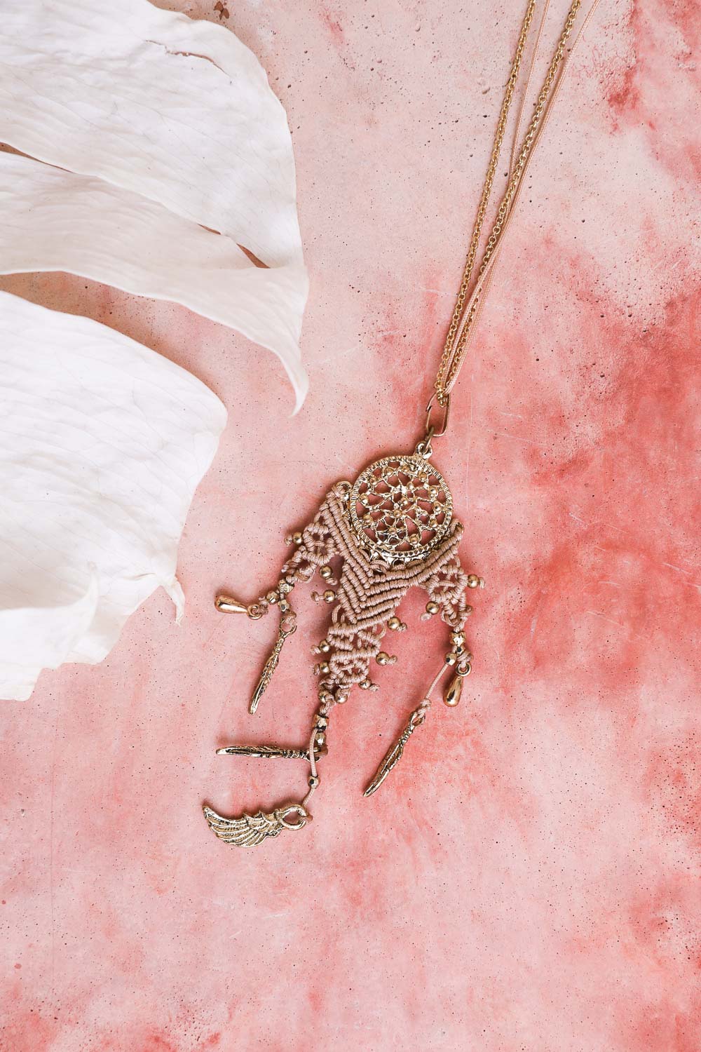 Leto Collection gold dreamcatcher necklace with dangling charms on pink background Boho Necklace, Boho Chic Jewelry, Spiritual