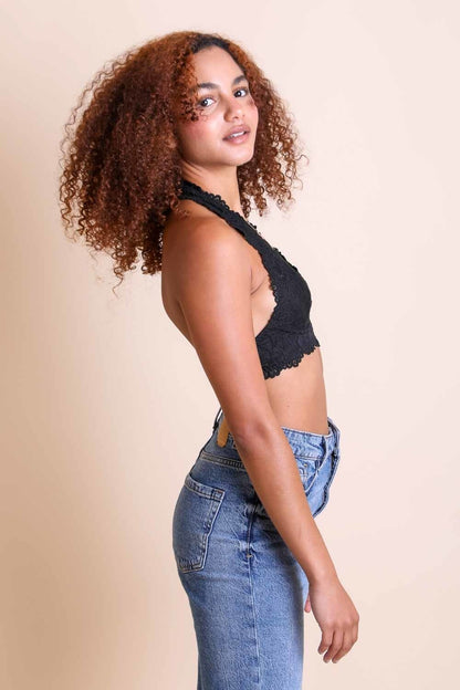 Leto Collection floral lace halter bralette paired with high-waisted jeans for a chic look
