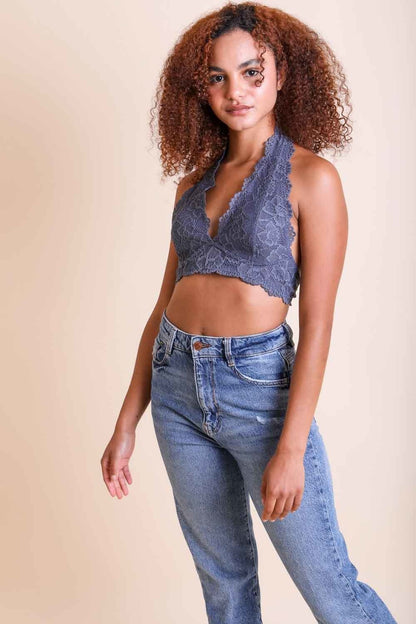 Floral lace halter bralette in gray, styled with high-waisted jeans for a trendy look