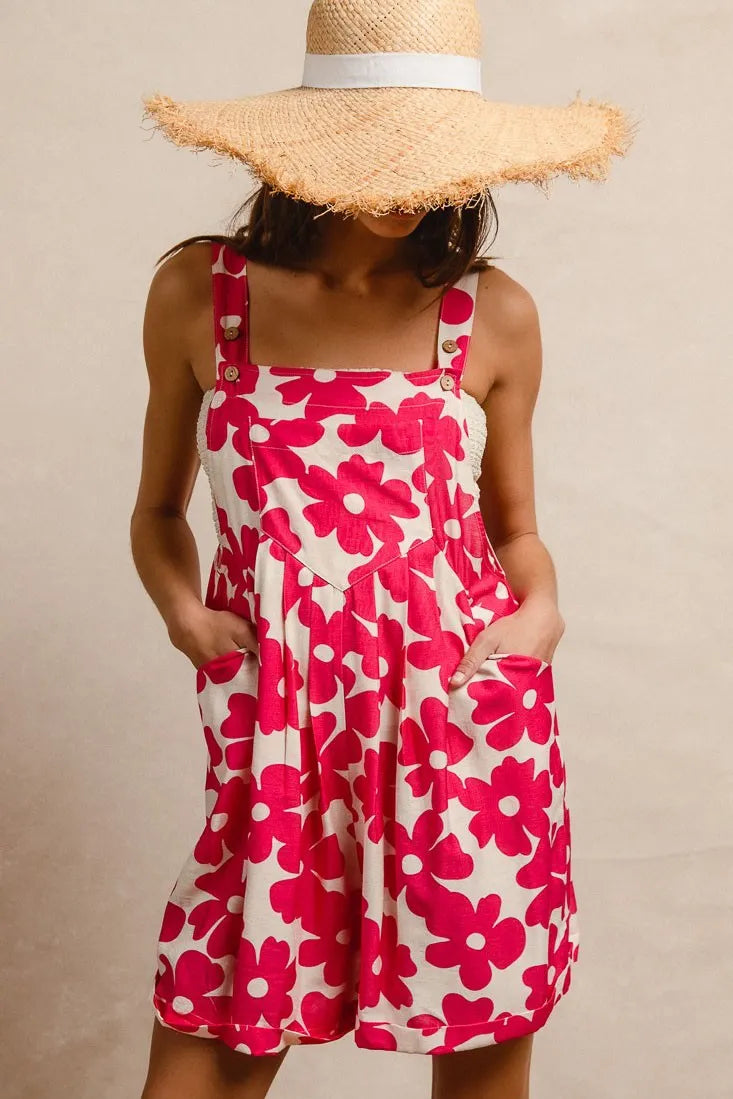 Floral print short overalls for women in pink and white with pockets and adjustable straps