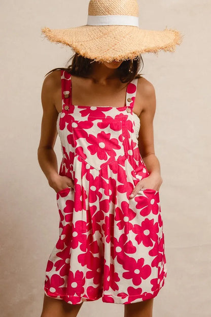 Floral print short overalls for women in pink and white with pockets and adjustable straps