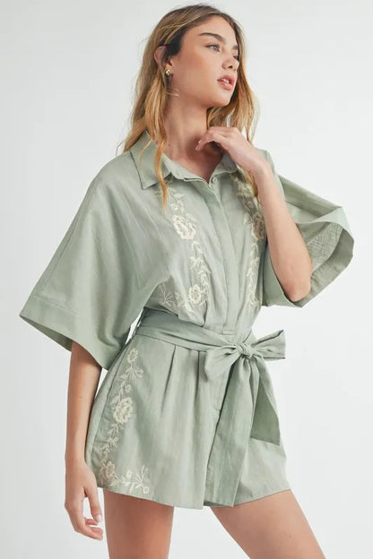 Trendsi embroidered button down romper in light green with floral details and a belted waist