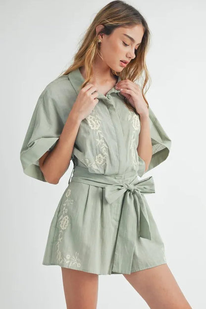 Trendsi embroidered button down romper in soft green with floral detailing and a belted waist