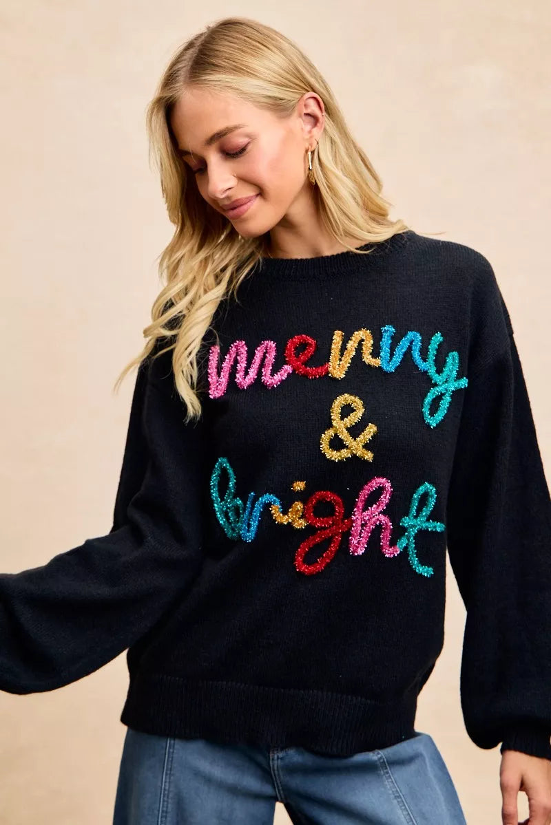 Tinsel lettering Christmas sweater in black with colorful 'merry & bright' design for festive holiday style