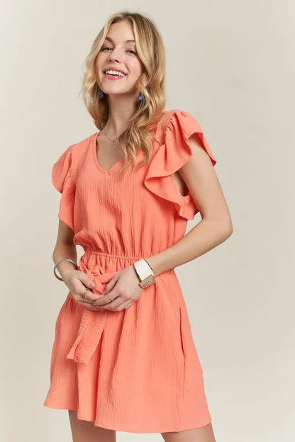 Trendsi boho ruffle sleeve romper in coral with a flattering fit and stylish design