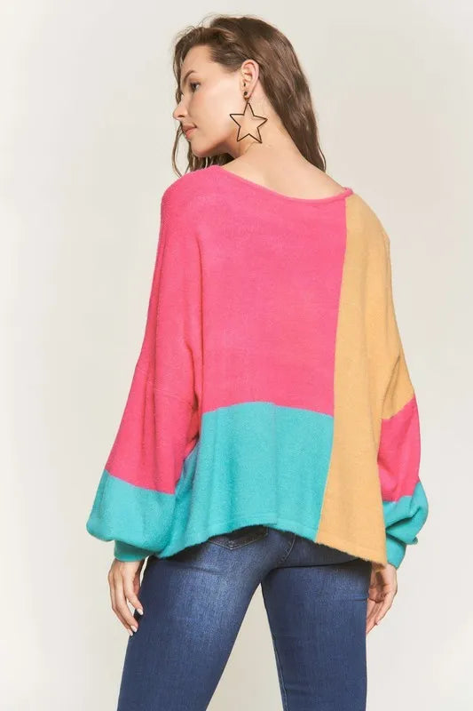 Trendy boho colorblock sweater in pink, yellow, and teal with oversized sleeves for a stylish look