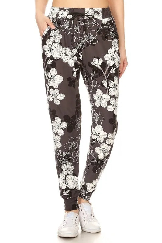 Trendsi buttery soft floral joggers in black with white floral pattern and elastic waistband