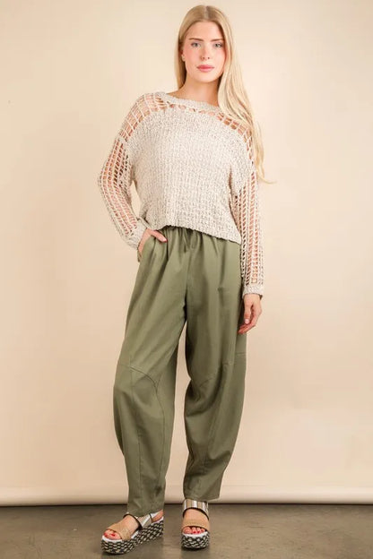 Trendy boho woven pants for women in olive green, paired with a stylish knit top for a chic look
