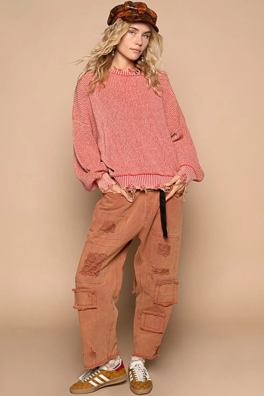 Trendsi boho distressed sweater for women in pink, styled with relaxed pants and trendy accessories