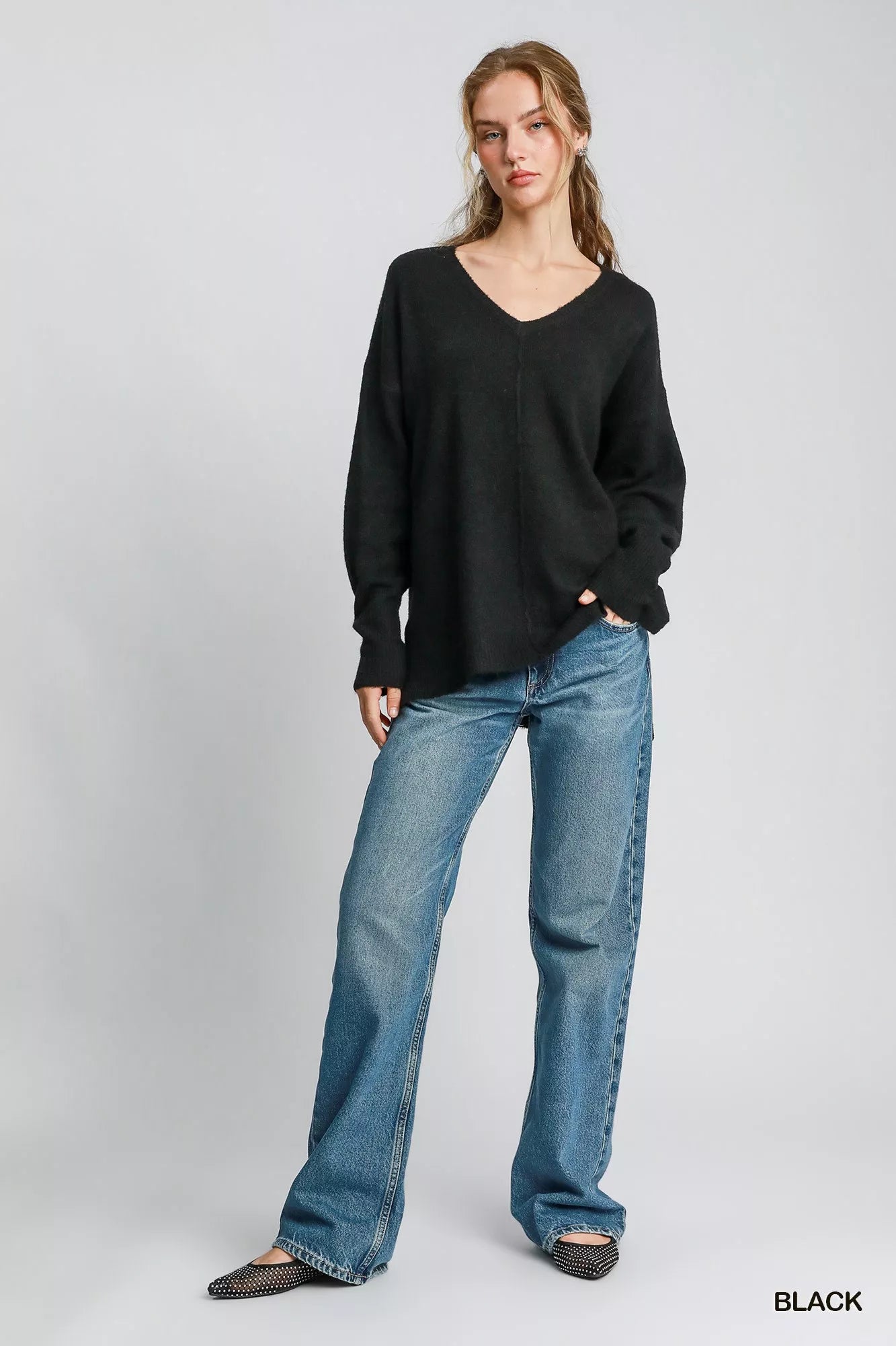 Umgee wool blend pullover sweater in black, styled with relaxed jeans for a casual look