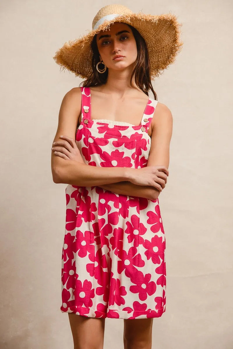 Trendy floral print short overalls for women in pink and white, perfect for summer outings