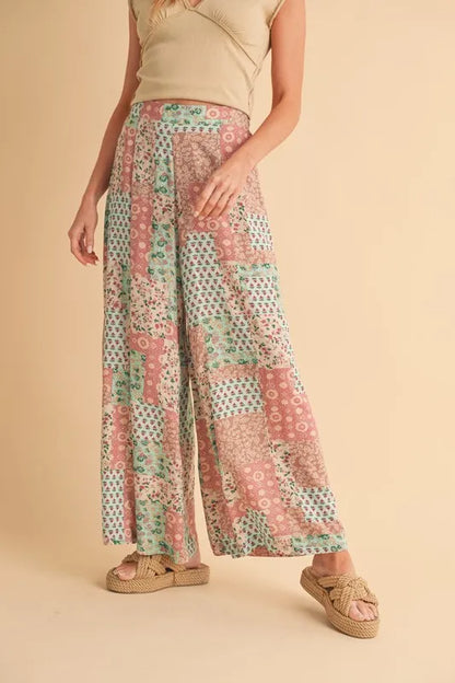 Trendy boho wide leg pants in pastel colors featuring a floral patchwork design